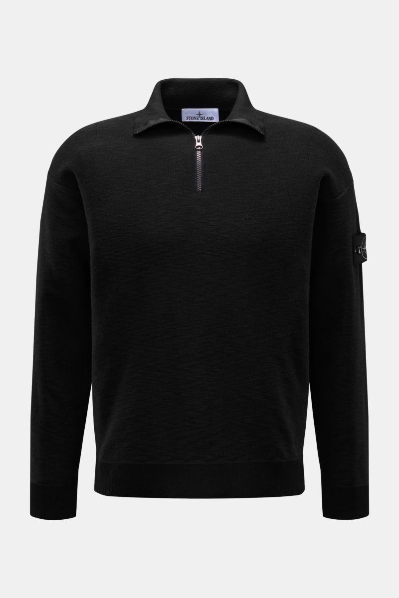 Stone Island Half-zip jumper black shown from the front, featuring a slim fit, standing collar with zipper, purl stitch texture, and signature compass badge. Knit with a twist: The sporty half-zip jumper by STONE ISLAND in a modern purl stitch is an ideal