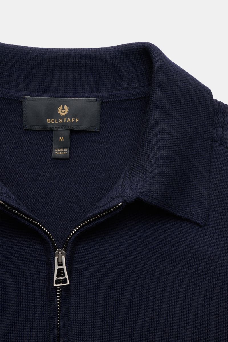Close-up front view of Belstaff Knit polo 'Kyle' navy, a slim fit pure wool knit polo with a soft feel, fine knit, zip collar, woven sleeve label, and ribbed bands. Polo look meets fine wool: Stylish casual looks are effortless with this knit polo by BELS