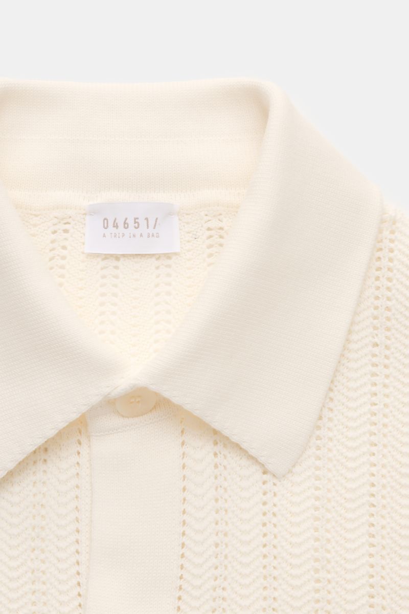 Close-up front view of 04651/ A trip in a bag Short-sleeved knit shirt narrow collar cream with textured pure cotton knit.

Summery ease: With a casual cut and comfortable cotton, this short sleeve knit shirt by 04651/ A TRIP IN A BAG is the perfect co