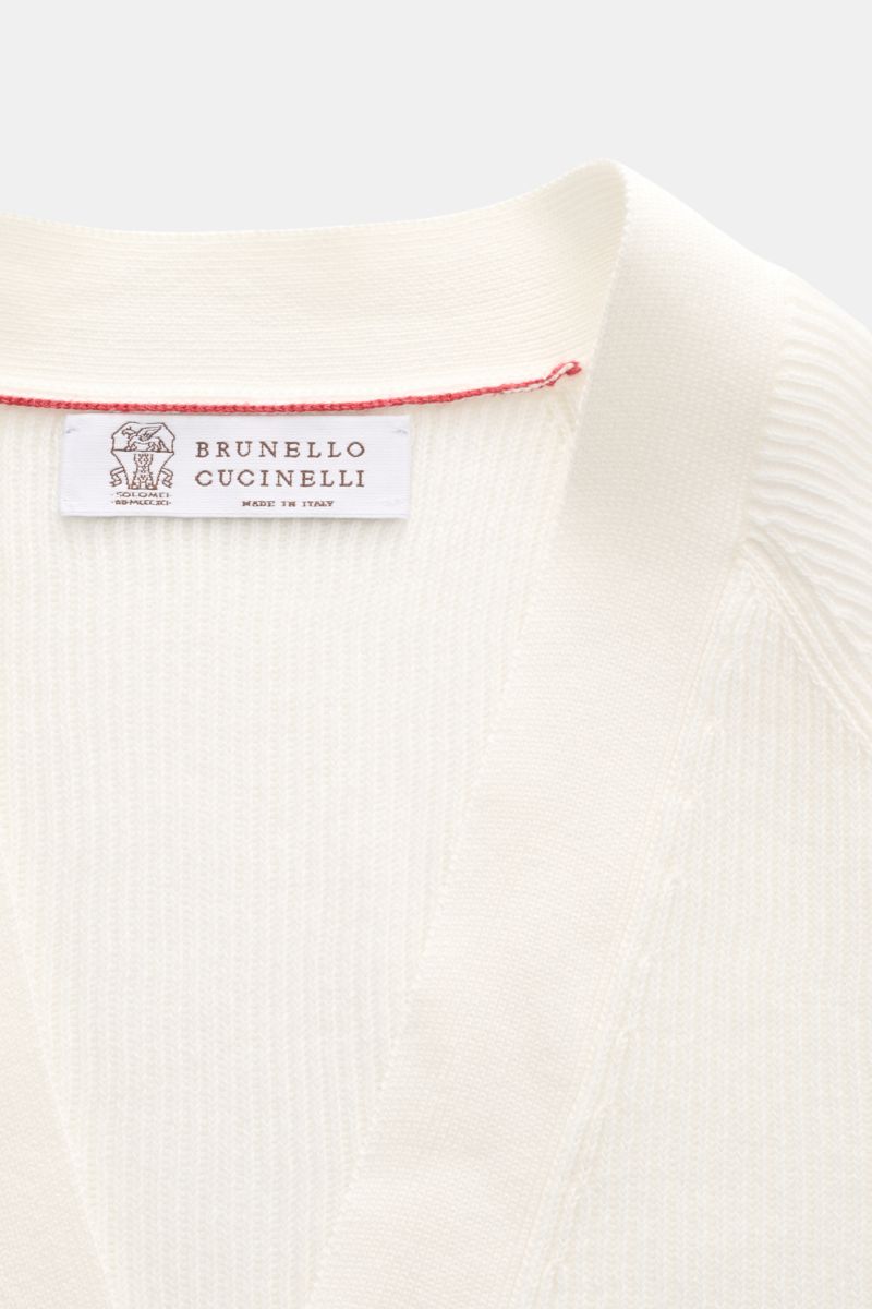 Close-up front view of Brunello Cucinelli Cardigan off-white showing fine brioche knit and label.

Description: Luxury for the office and your downtime: This cardigan in fine brioche knit in soft cotton enhanced with crest buttons by BRUNELLO CUCINELLI