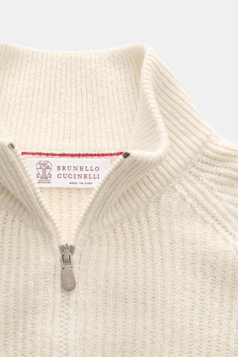 Close-up front view of the Brunello Cucinelli Cardigan cream showing the close-fitting standing collar and two-way zip in soft cotton brioche knit.

BRUNELLO CUCINELLI adds luxury to your casual wardrobe with this cardigan in brioche knit in soft cotto
