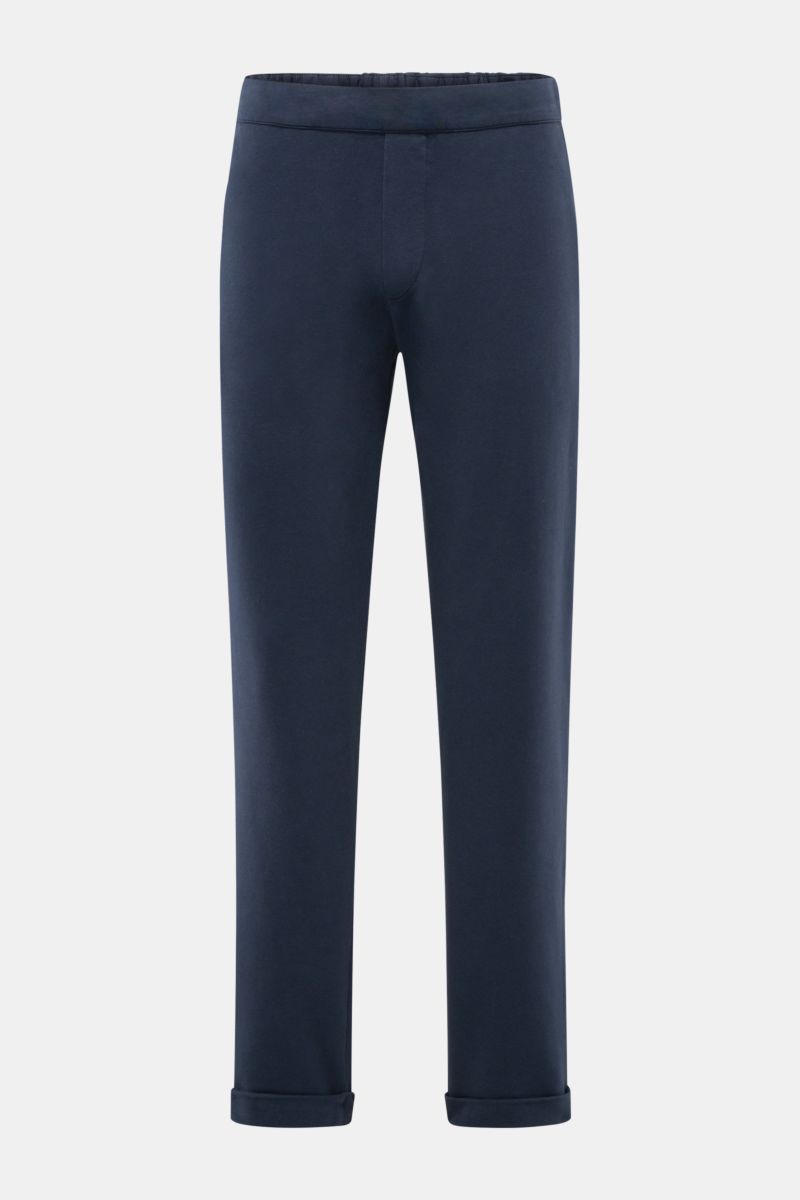 Front view of 04651/ A trip in a bag Jogger pants 'If' navy in soft cotton jersey with tapered fit, elasticated waistband, faux fly, French pockets, patch back pocket, and fixed hem turn-up, showcasing comfort and modern silhouette.

Comfort meets styl