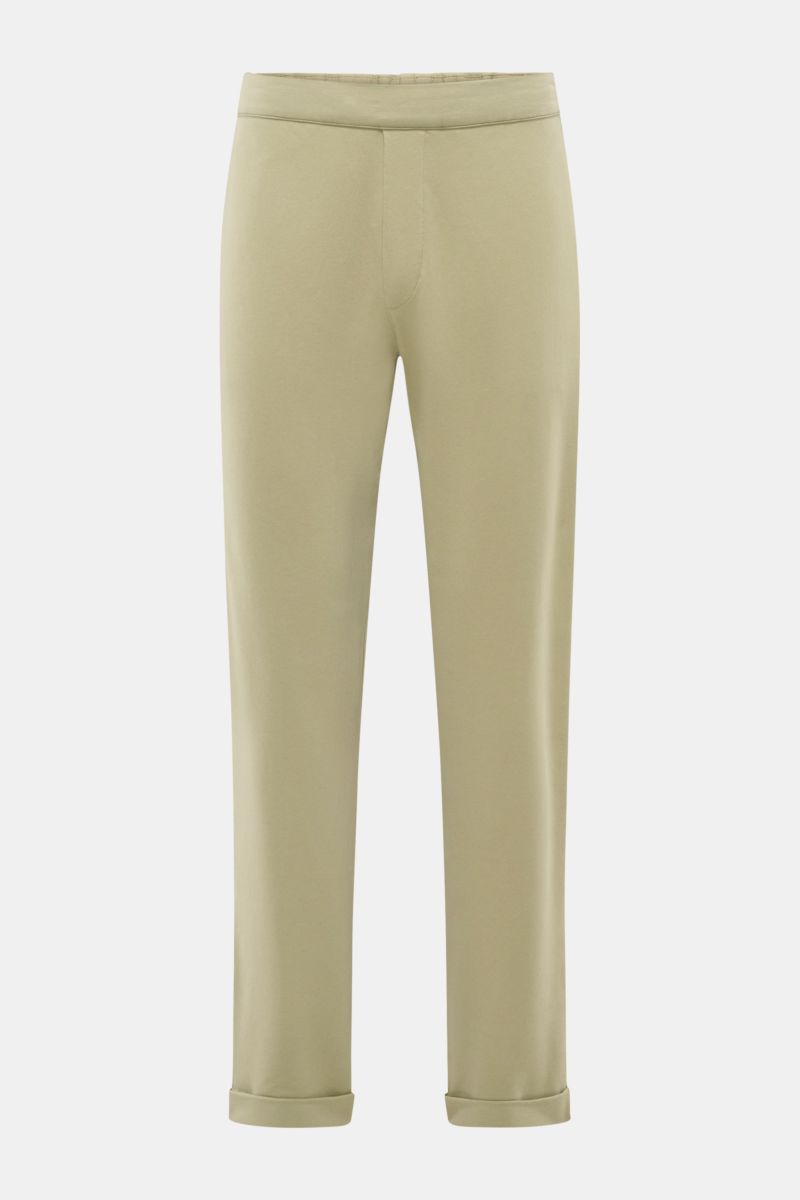 Front view of 04651/ A trip in a bag Jogger pants 'If' sage in soft cotton jersey with tapered fit, elastic waistband, French pockets, and fixed hem turn-up.

Comfort meets style: These jogger pants in soft cotton jersey by 04651/ A TRIP IN A BAG enhan