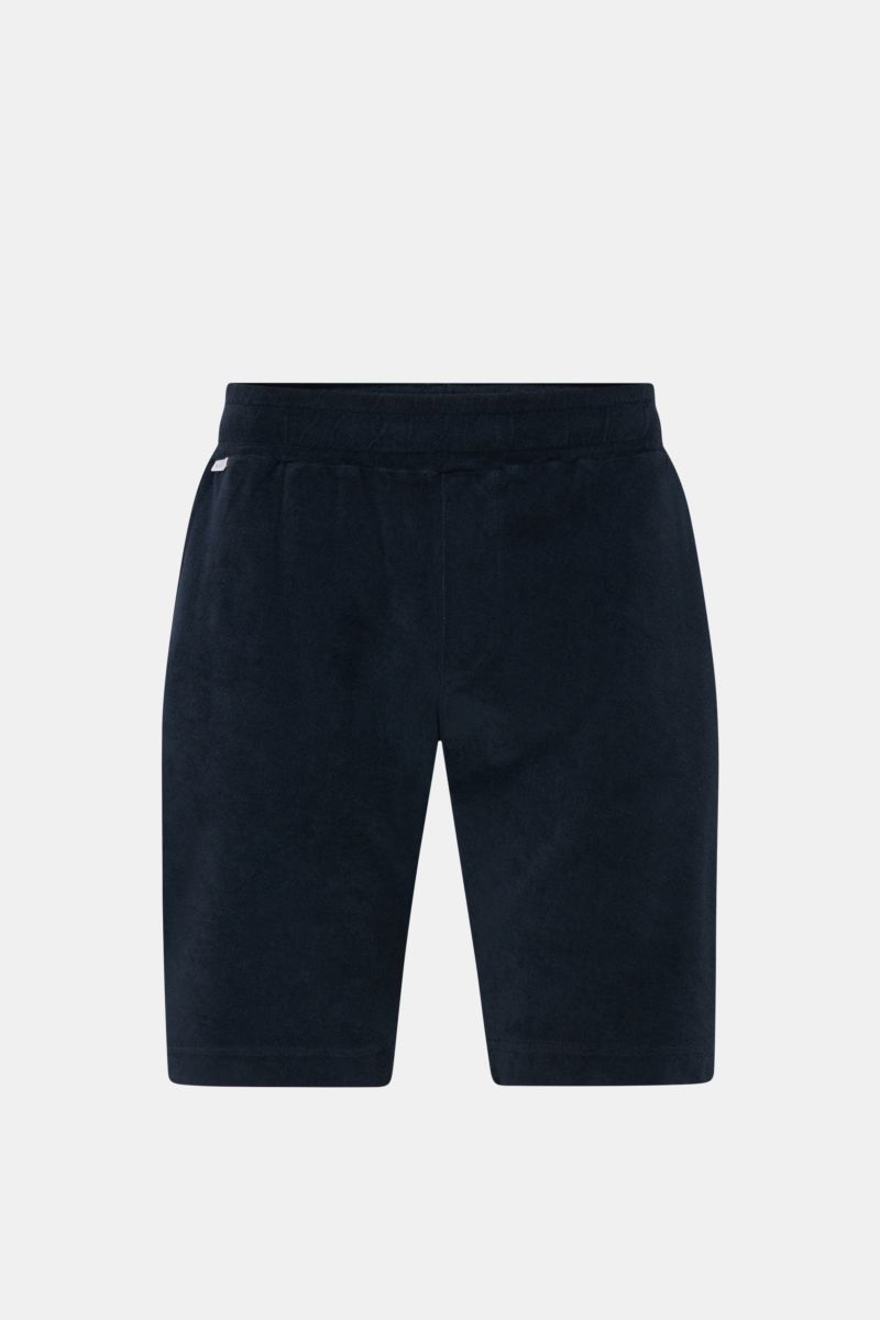 Front view of 04651/ A trip in a bag 'Terry' shorts navy made of soft pure cotton terrycloth with elastic waistband, drawstring, and pockets.

With the model 'Terry' 04651/ A TRIP IN A BAG presents a comfortable pair of shorts in wonderfully soft terry