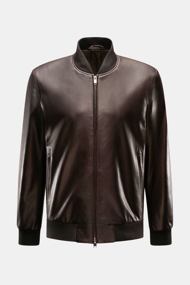 Front view of Brioni Leather blouson 'Plad' dark brown in elegant lambskin leather, slim fit with two-way zip, zip front pockets, elastic hem and sleeve cuffs, smooth lining, and one inside pocket. A statement in fine craftsmanship with a smooth feel addi