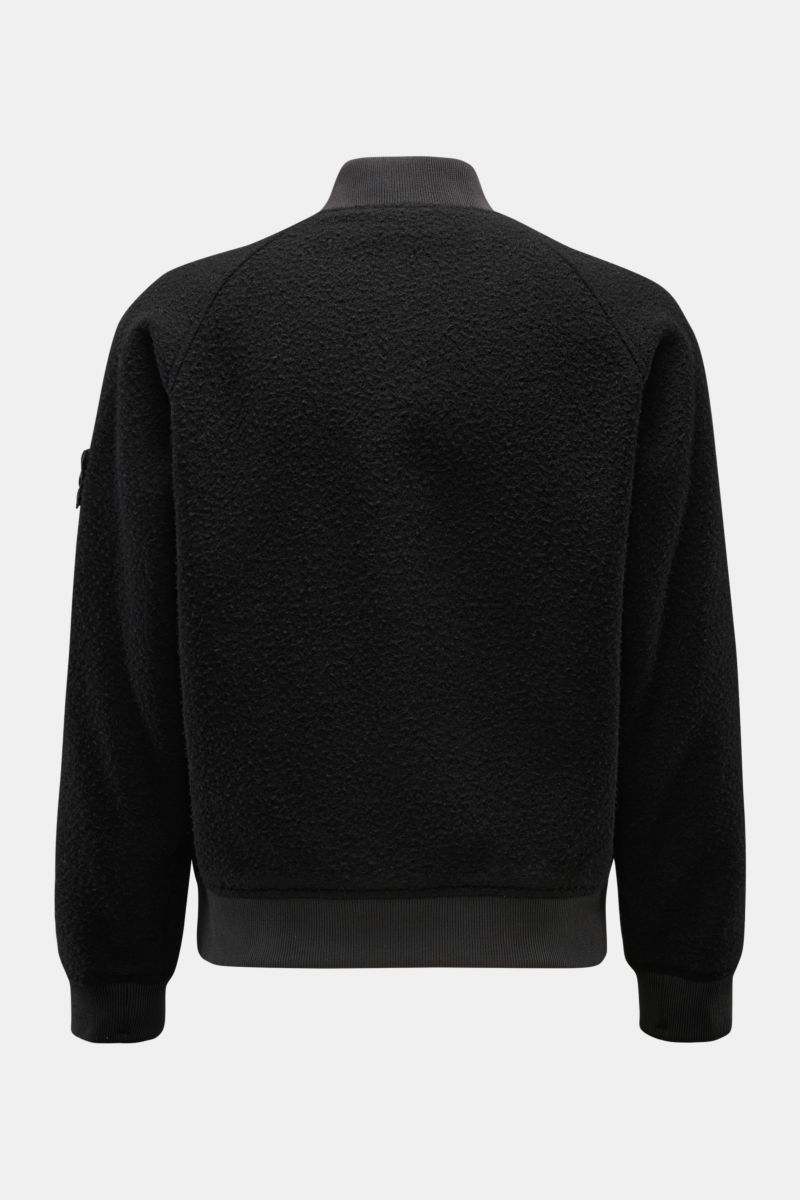 Rear view of Stone Island Blouson 'Panno Ratinato' schwarz in black wool-mix with raglan sleeves, ribbed collar, cuffs, and hem.