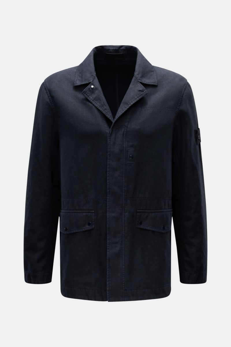 Front view of Stone Island Jacket 'Ghost Piece' navy in linen and microfiber blend, slim fit with concealed button placket, adjustable collar, flap hip pockets, tonal sleeve badge, and snap button cuffs, perfect for spring casual wear.