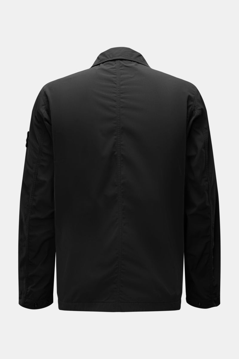 Rear view of Stone Island Jacke 'Micro Twill' schwarz, a slim fit black jacket with smooth microfibre, water-repellent finish, falling collar, and adjustable button cuffs. Eleganz trifft Funktion: Die STONE ISLAND Jacke überzeugt mit Micro-Twill in glatte
