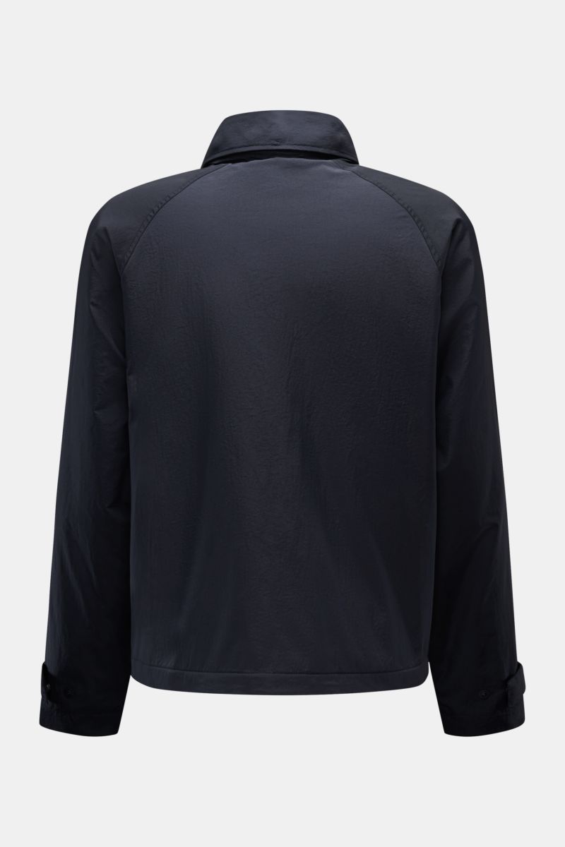 Back view of the 04651/ A trip in a bag Jacket dark navy made of high-quality microfibre with smooth feel, lightweight padding, wind and water repellent, regular fit, zip, concealed hood in collar, raglan sleeves, hip pockets with flap, small woven label 