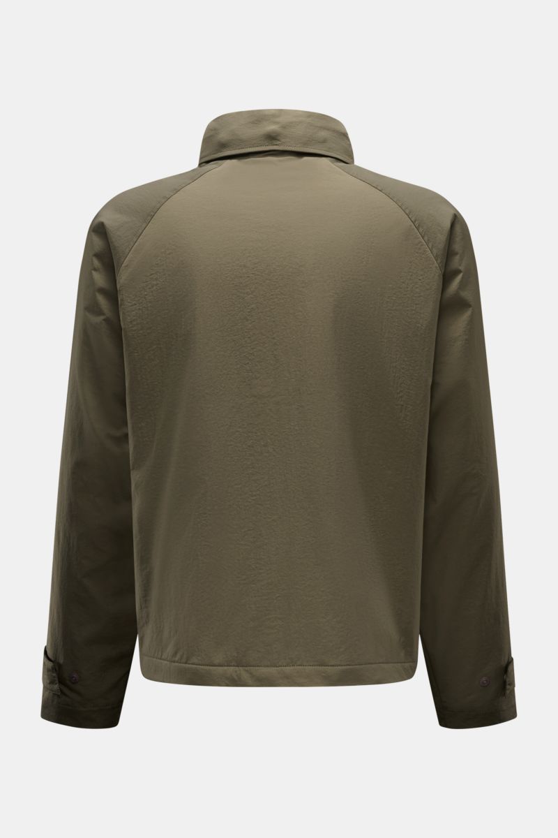 Back view of the 04651/ A trip in a bag Jacket olive, made of high-quality microfibre with smooth feel, lightweight padding, wind and water repellent, regular fit, zip, concealed hood in collar, raglan sleeves, hip pockets with flap, small woven label in 