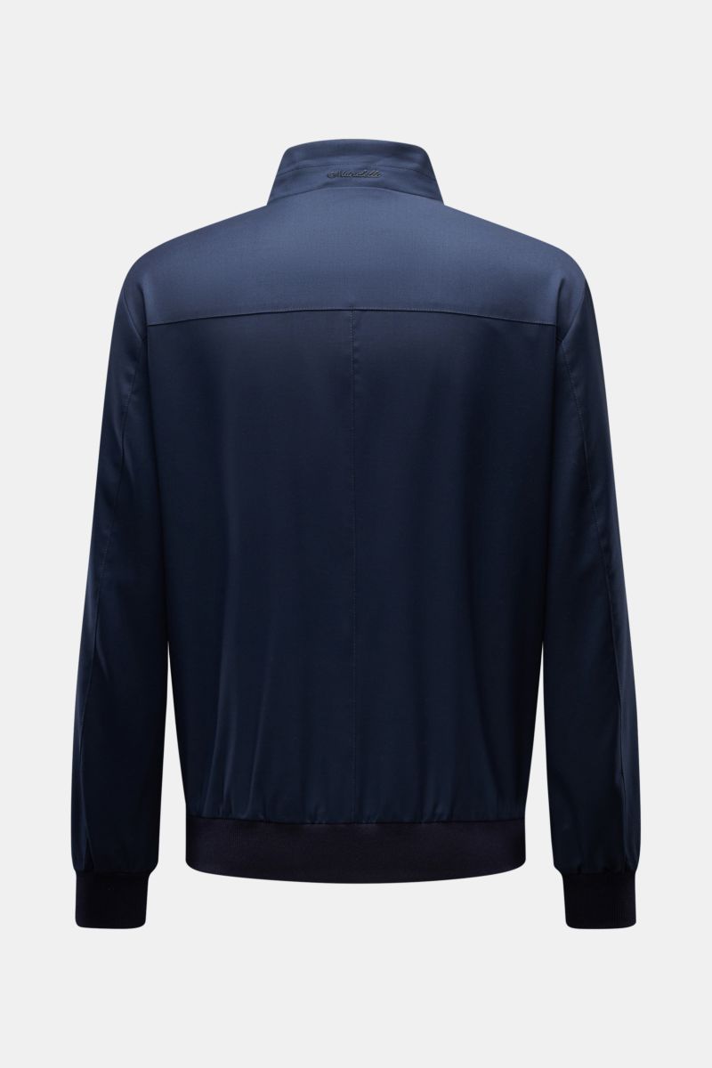 Back view of Mandelli Blouson navy in pure wool with standing collar, slim fit, two-way zip, elastic hem and cuffs, smooth lining, and three inside pockets, photographed against a plain background. Elegant ease for the transitional period: this blouson by