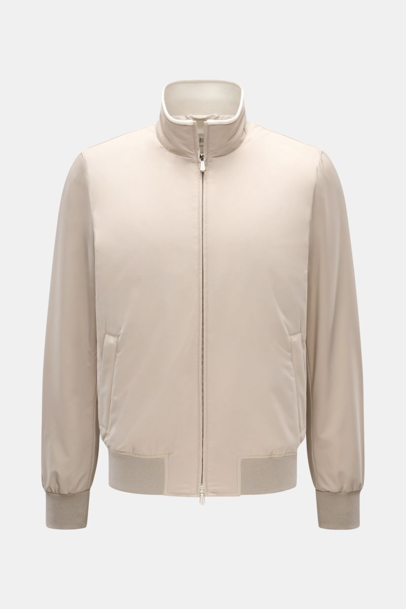 Front view of Mandelli Blouson beige, a slim fit, high-quality microfibre jacket with goat suede trim, ribbed bands, two-way zip, hip and inside pockets, and a high-closing standing collar, combining luxury and comfort for mild days.