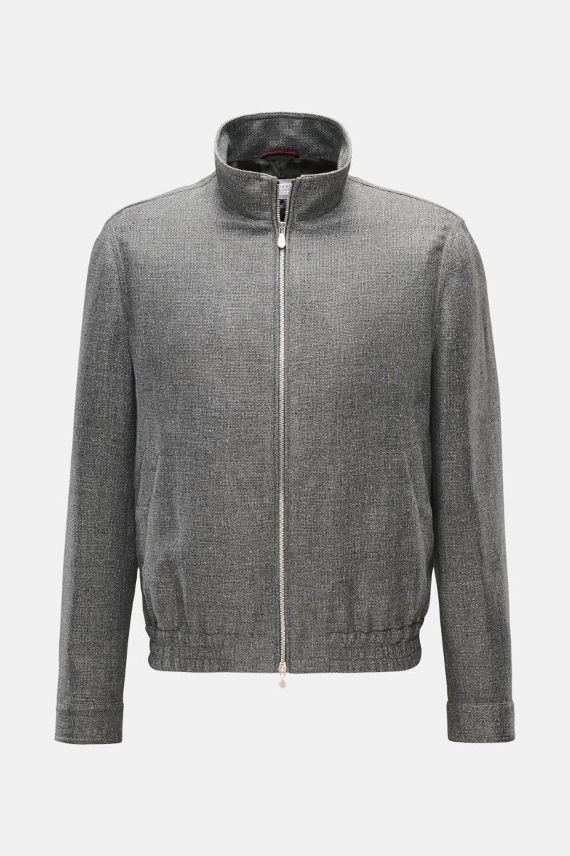 Front view of the Brunello Cucinelli Blouson sand meliert, a lightweight jacket in a wool, cashmere, and silk blend with a smooth feel, denim look, slim fit, two-way zipper, stand-up collar, slanted flap pockets with snap buttons, snap-button sleeve cuffs