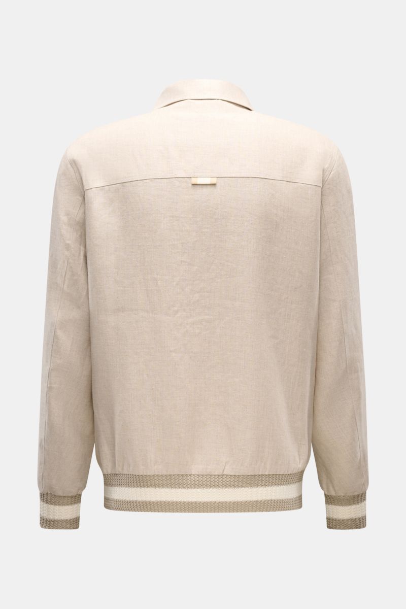 Rückansicht des Ché Blouson 'Benito' beige meliert aus leicht griffigem, reinem Leinen mit Umlegekragen und elastischen Bündchen.