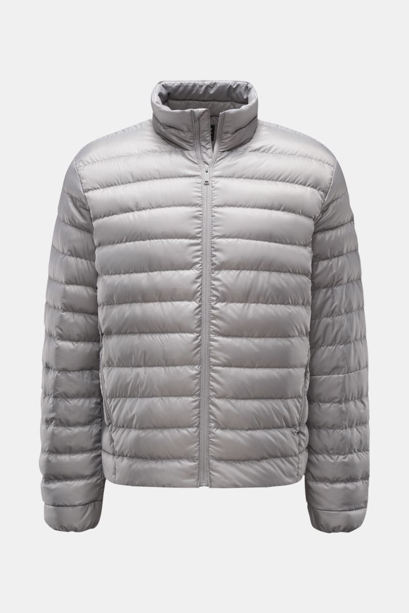 Front view of the Canada Goose Down jacket 'Stratus Tonal' light grey, a super lightweight, slim-fit, self-stowing down jacket with ripstop microfiber fabric, padded collar, two zip front pockets, elasticated cuffs, adjustable hem, tonal lining, and robus