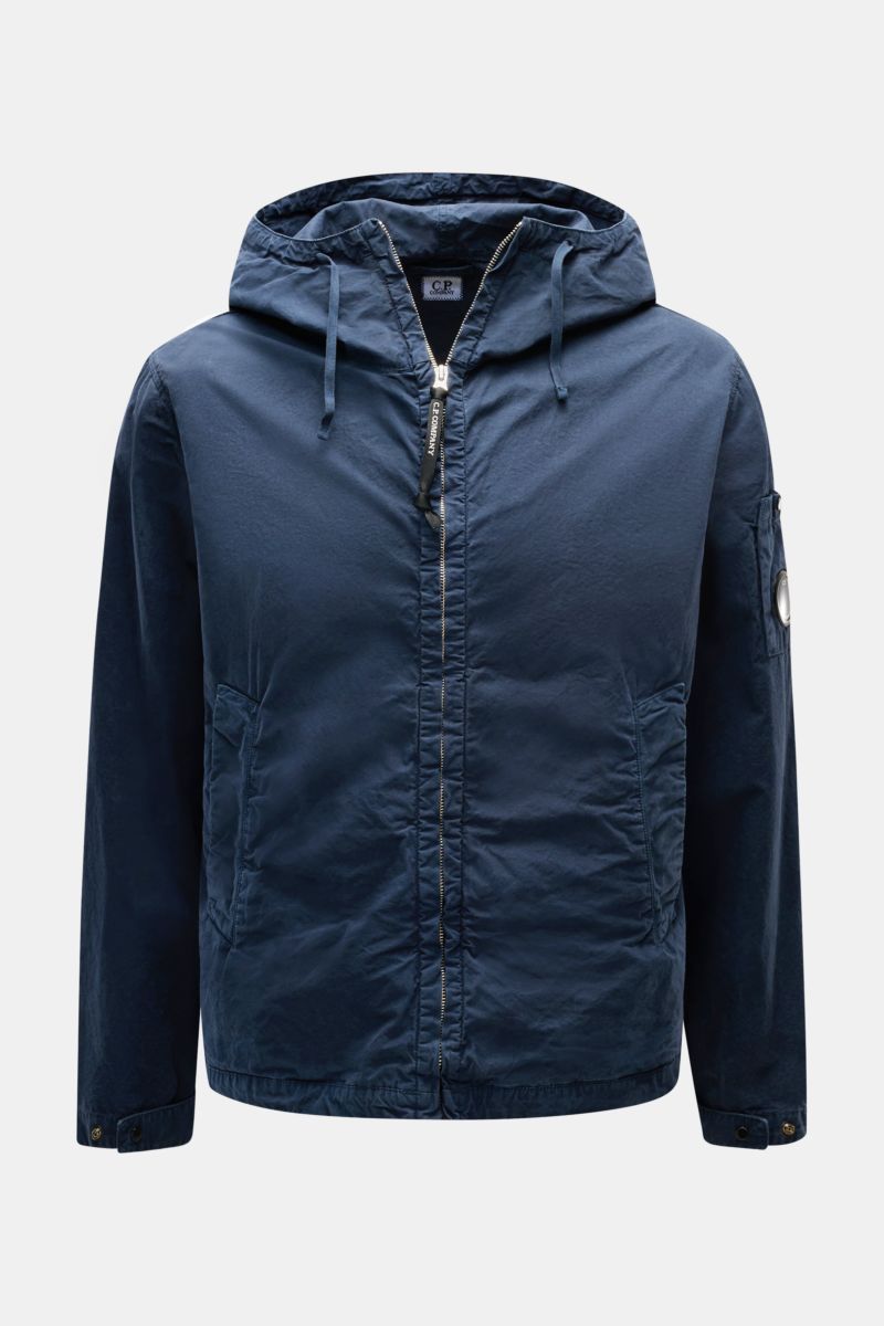 Front view of C.P. Company Jacket navy in lightweight, garment-dyed pure cotton Micro-Reps fabric, with hood, metal zip, and logo pocket on sleeve.