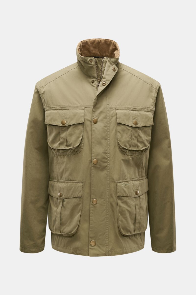Front view of Barbour Field jacket 'Sanderling' olive, lightweight cotton and microfiber blend with four bellows pockets, two-way zip, storm flap, corduroy-trimmed standing collar, snap buttons, leather logo, and half tartan lining, designed for everyday 