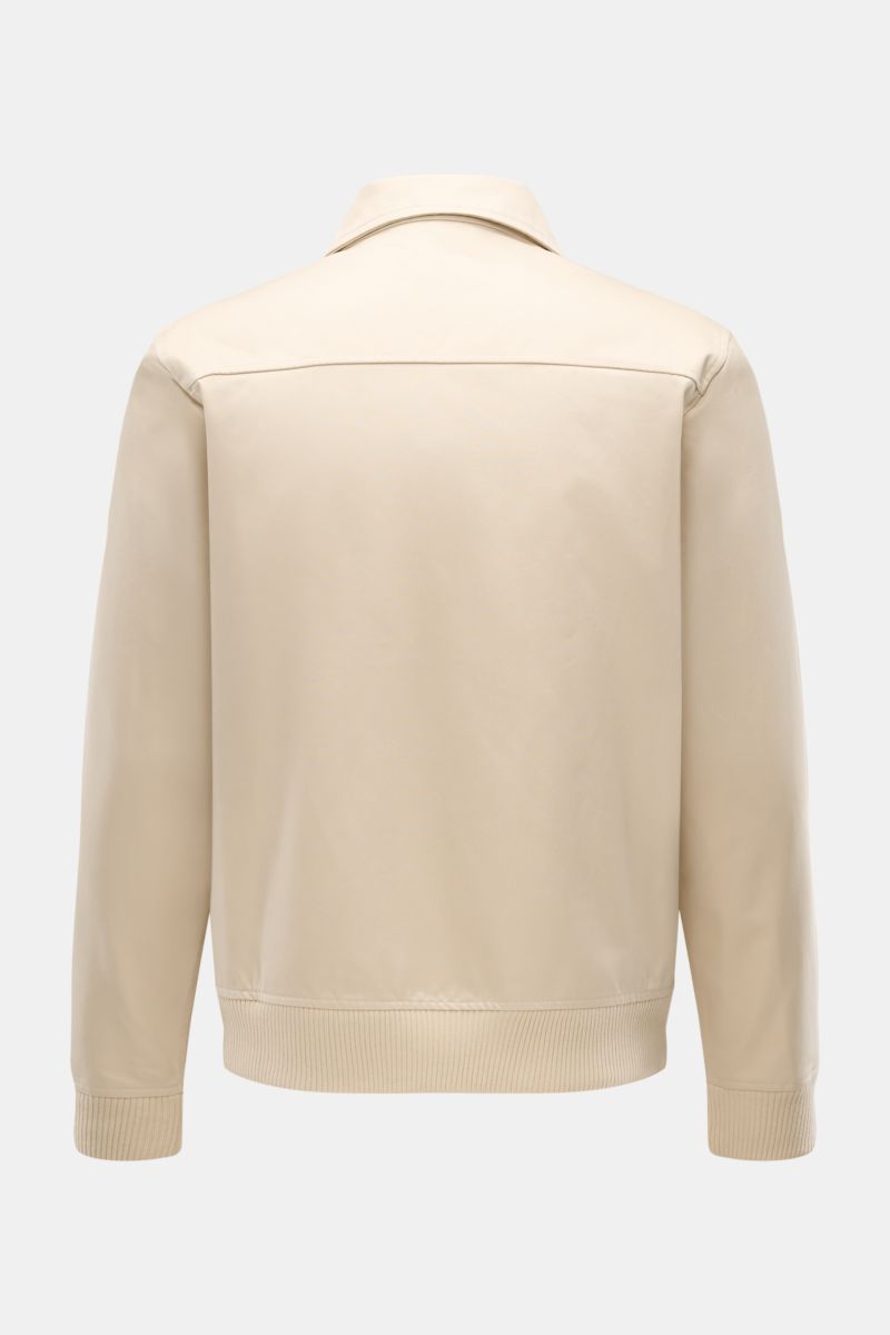 Rear view of 04651/ A trip in a bag Blouson 'Griffin' beige showing unconstructed design, pure cotton fabric, slim fit with elastic cuffs and waistband.