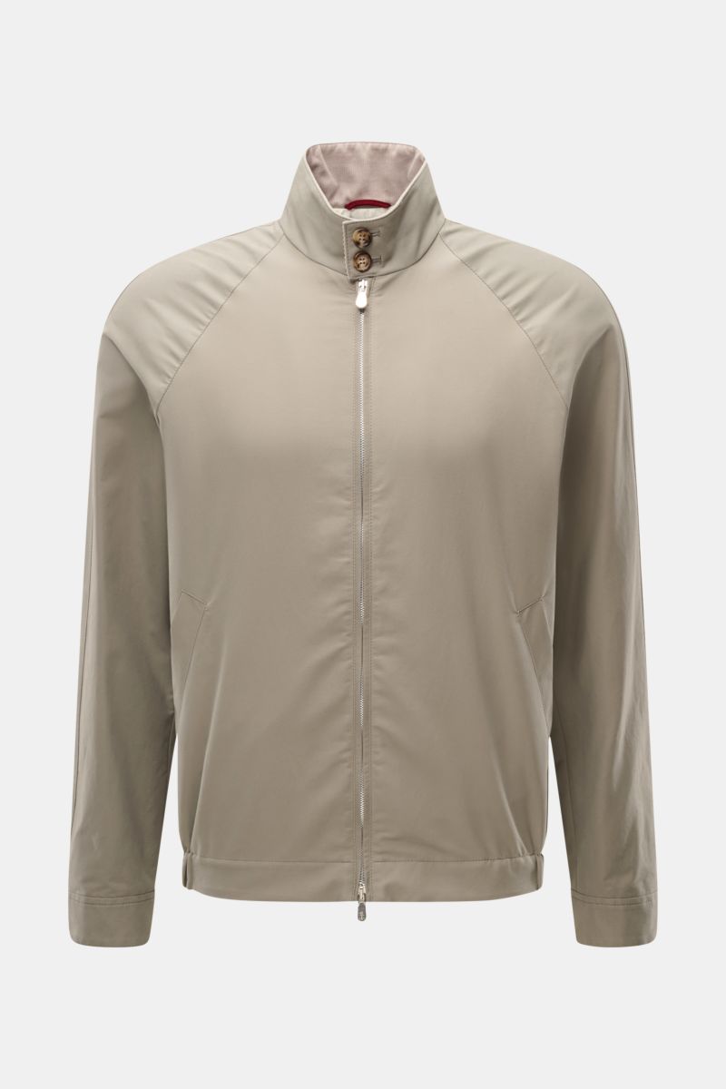 Front view of the Brunello Cucinelli Blouson salbei in beige, showcasing a slim fit, water-repellent cotton-microfiber twill with fine corduroy details, stand collar with button tab, raglan sleeves, two-way zipper, slanted welt pockets, elastic hem, butto