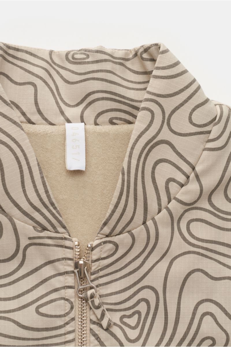 04651/ A trip in a bag Outdoor gilet 'Seamap' beige patterned