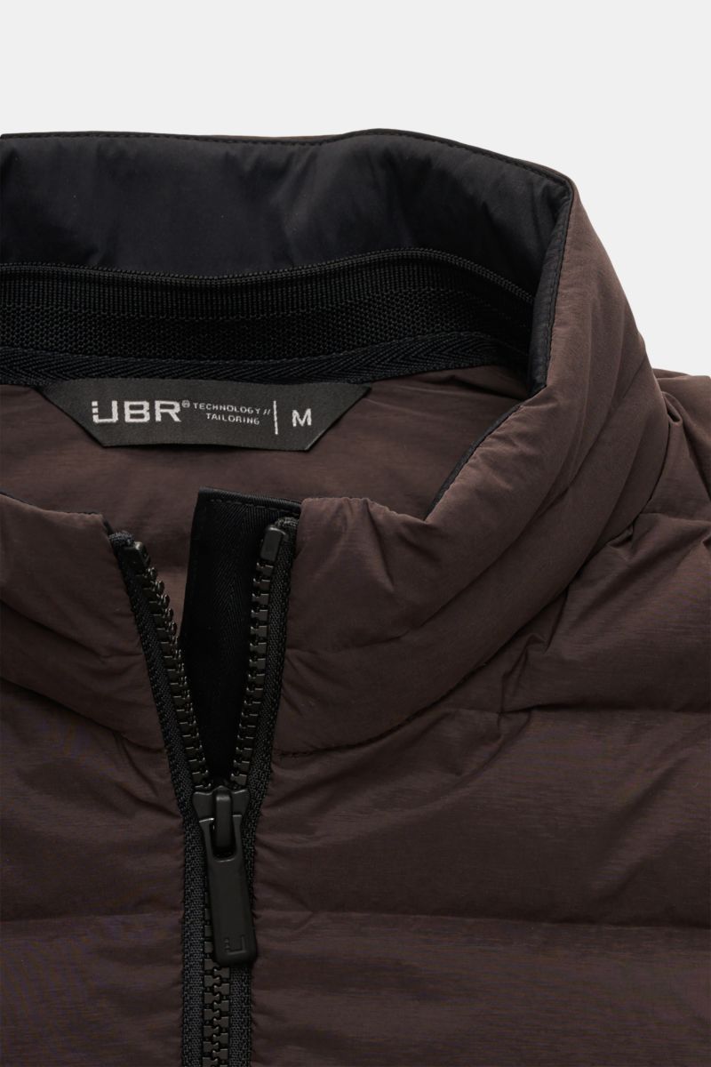 Close-up front view of the UBR Down gilet 'Supersonic' grey-brown showing the high collar, two-way black zipper, and stretchy microfiber fabric with lightweight down lining for warmth and water repellence.