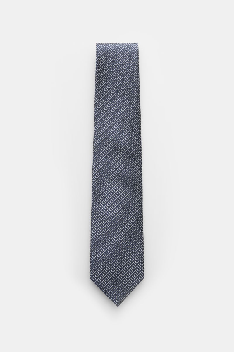 Tom Ford Seidenkrawatte navy/creme gemustert, frontale Draufsicht, reine Seide, dezenter Glanz, grafisches Muster, Logo-Stitching, made in Italy, 8 cm breit.