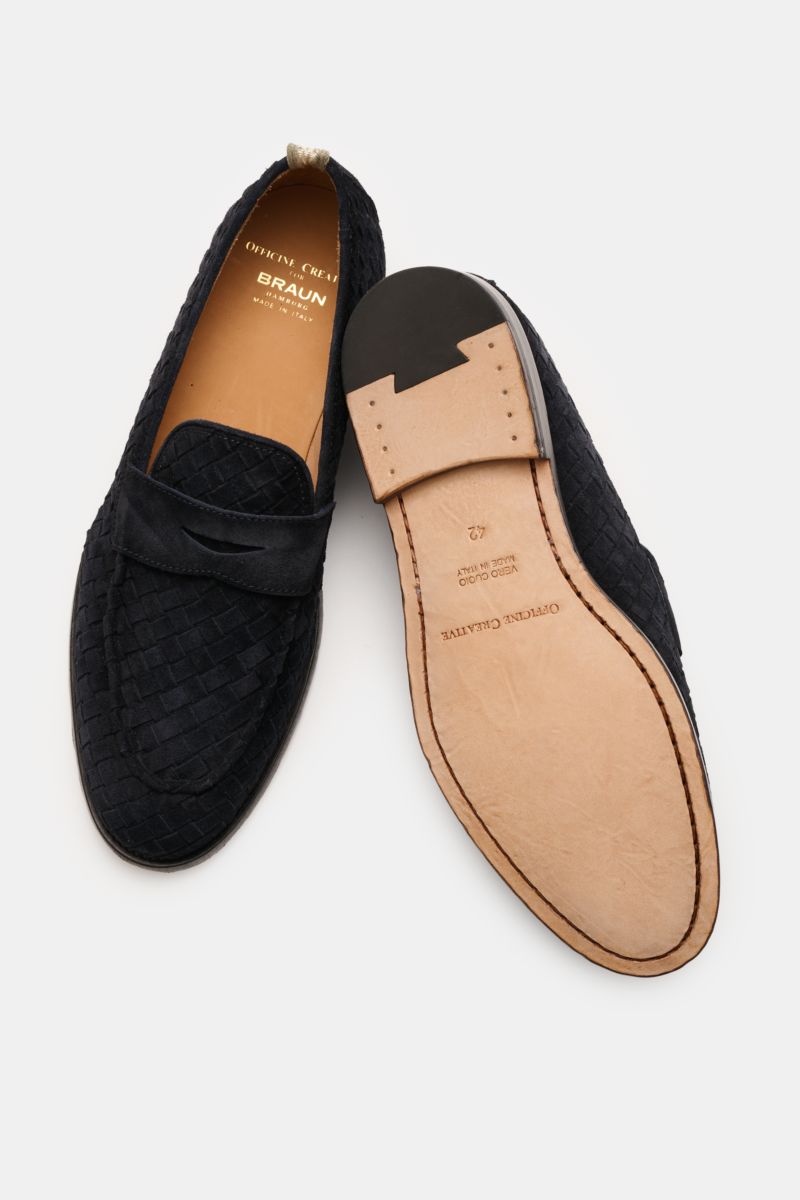 Officine Creative Penny Loafer 'Opera' dark navy shown from top and sole views, featuring woven suede, narrow silhouette, Blake construction, decorative front seam, penny strap, leather lining, and leather sole.

Description incorporating provided content