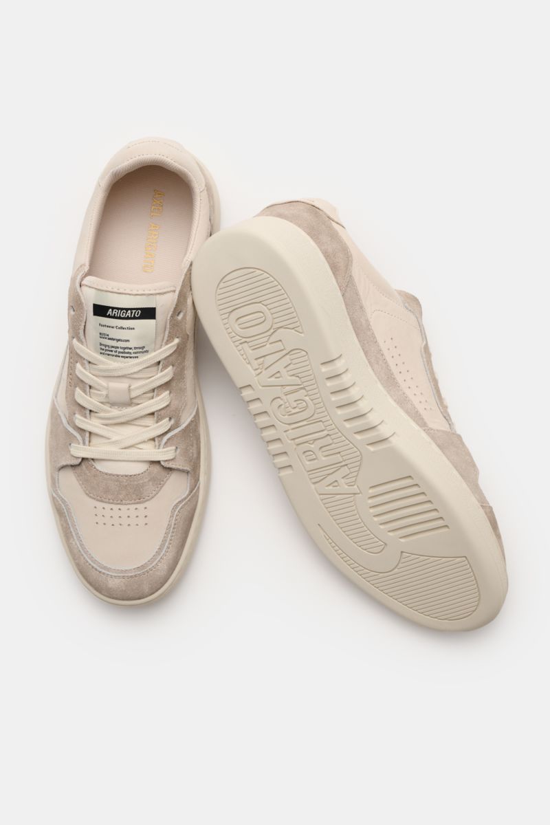 Top and sole view of Axel Arigato Sneakers 'Dice Lo' taupe/sand in retro design with premium nubuck leather, suede overlays, perforated round toe, six-eyelet lacing, padded topline, textile lining, padded footbed, and flexible rubber sole.

Description: 