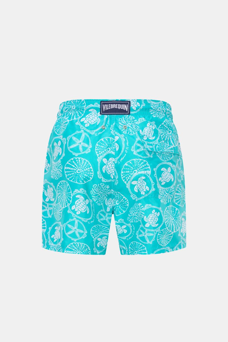 Rear view of Vilebrequin Swim shorts 'Moorea' turquoise/white patterned, made of high-quality microfibre with elasticated waistband, side pockets, back pocket with hook-and-loop fastener, drainage eyelets, mesh lining, and VILEBREQUIN label.