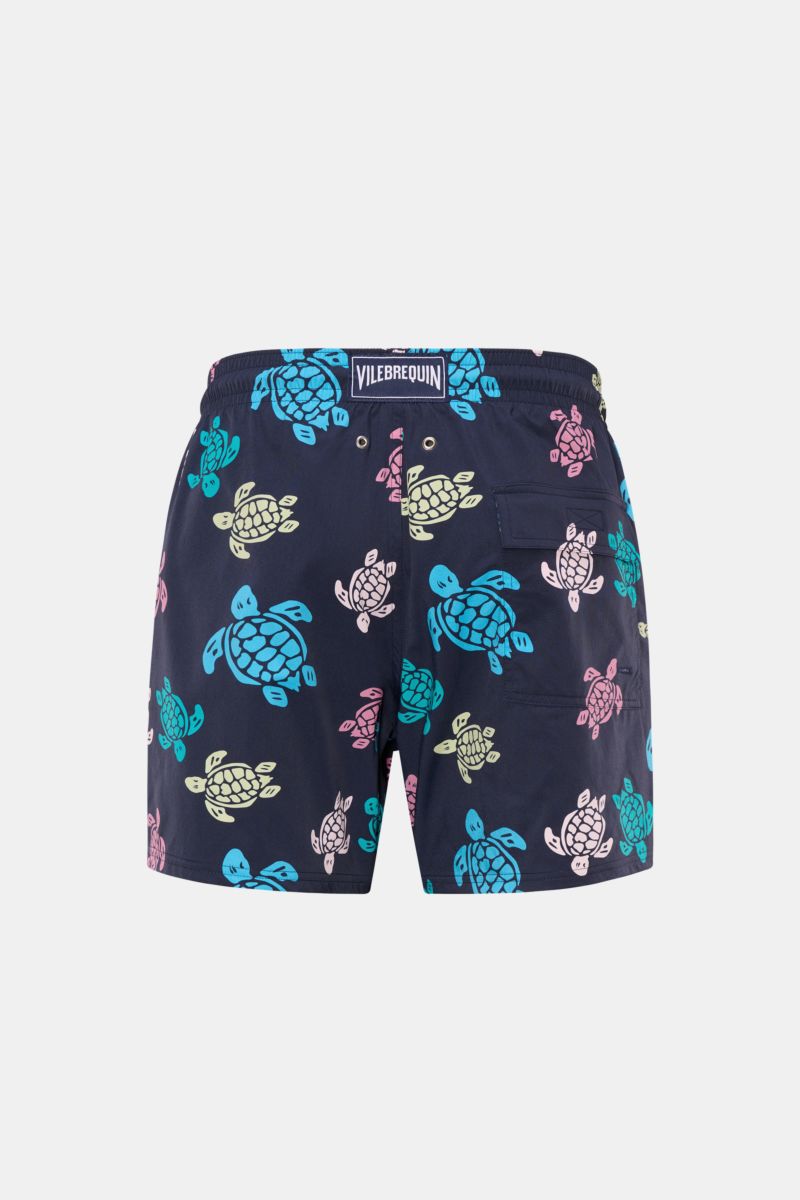 Vilebrequin Swim shorts 'Moorea' navy/blue/rose patterned shown from the back, featuring high-quality microfibre, elasticated waistband with drawstring, side seam pockets, back pocket with hook-and-loop fastener, drainage eyelets, VILEBREQUIN label, and m