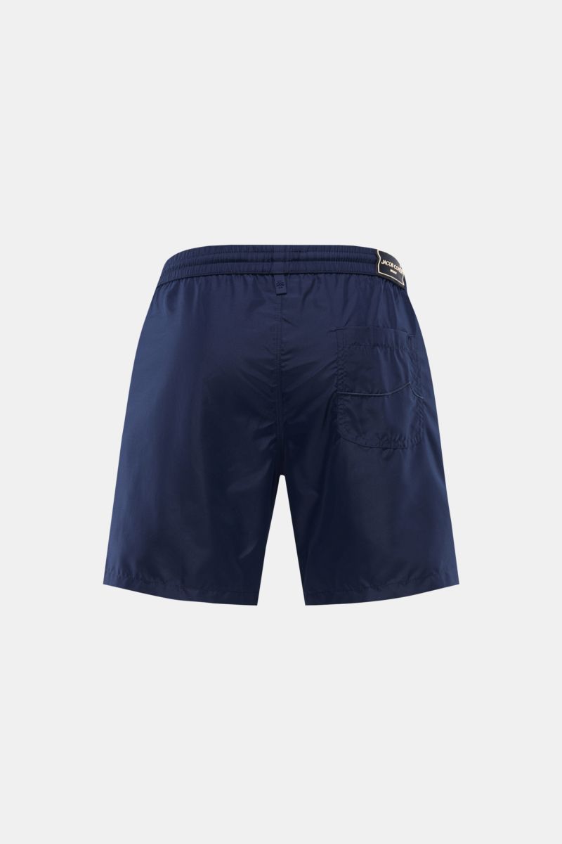 Rear view of Jacob Cohen Swim shorts navy in lightweight navy microfibre with elastic waistband, back pocket, and relaxed fit.

Description: Lightweight in your luggage: These swim shorts from JACOB COHEN, made from lightweight, high-quality microfibre