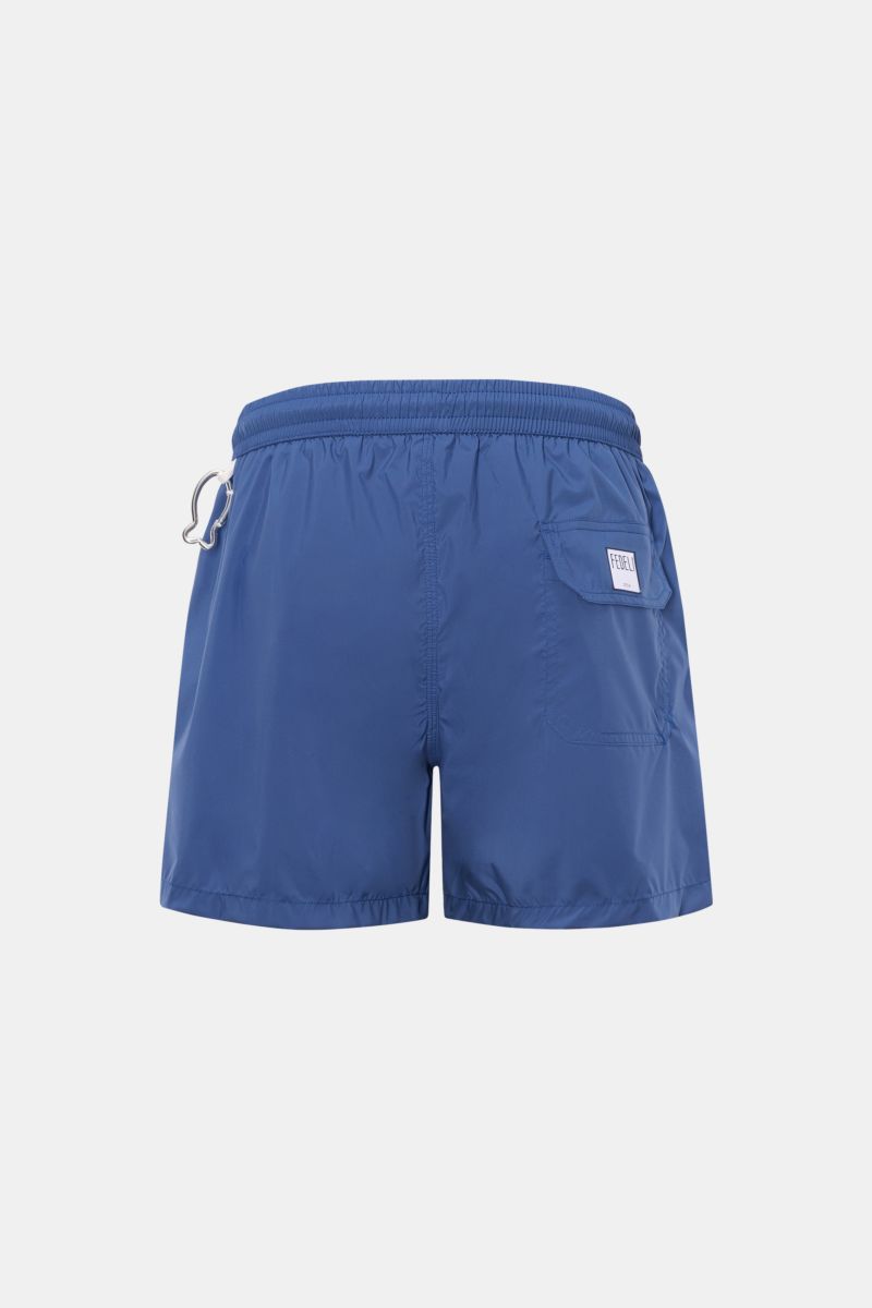 Rear view of Fedeli Swim shorts 'Madeira Airstop' dark blue, showing elasticated waistband, back pocket with hook-and-loop fastener, and whale-shaped carabiner.

Description: The swim shorts 'Madeira Airstop' by FEDELI are a timeless model for your sui
