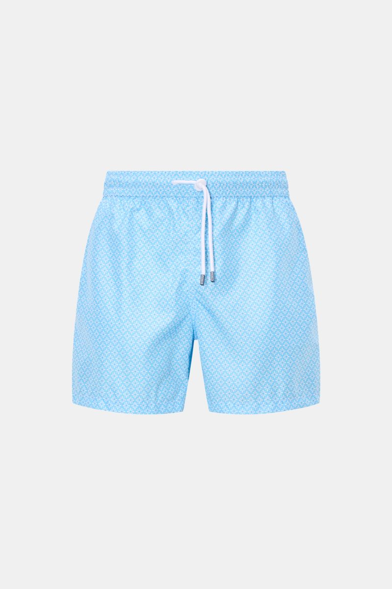 Front view of Fedeli Swim shorts 'Madeira Airstop' light blue/white patterned with elastic waistband, drawstring, and floral pattern.

Description: An essential for your summer vacation: These FEDELI swim shorts have an expressive pattern that adds stylis