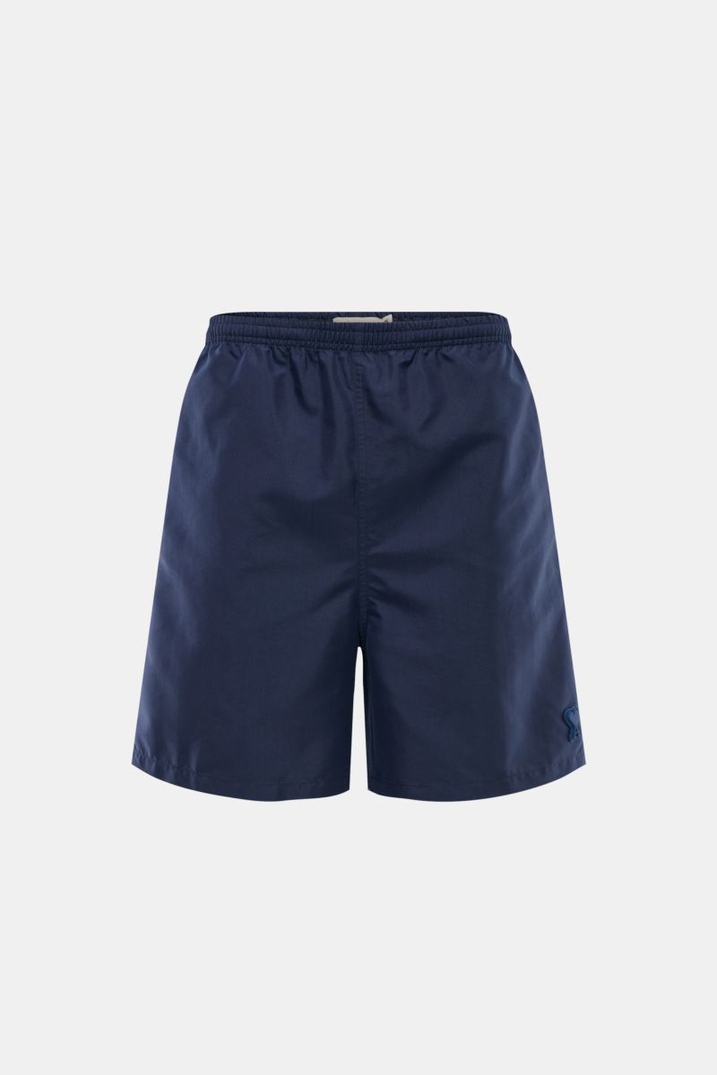 Front view of Ami Paris Swim shorts navy in solid dark blue with elasticated waistband and visible stitching, perfect for beach and pool.

Perfect for beach and pool: These swim shorts by AMI PARIS combine sporty style with fine microfibre fabric.
