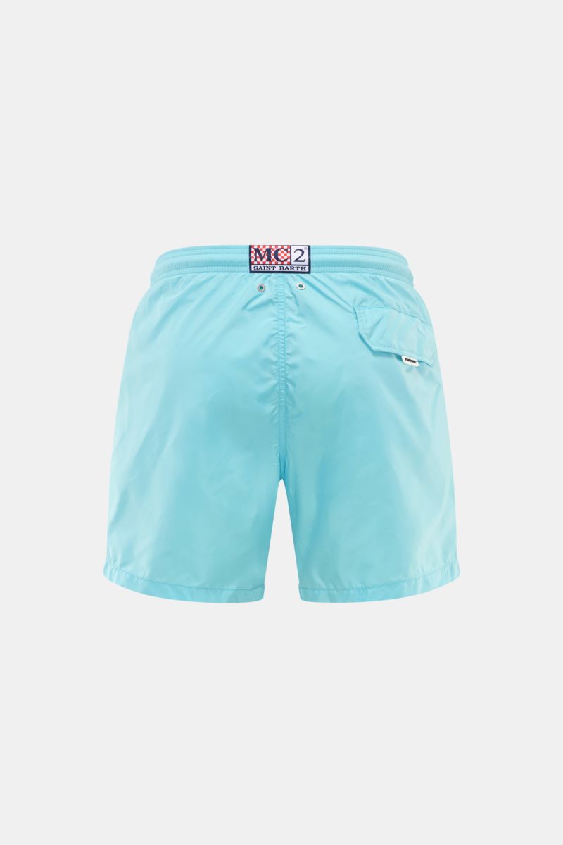 Back view of MC2 Saint Barth Swim shorts 'Lightning Pantone' turquoise in lightweight recycled microfibre with elasticated waistband, side seam pockets, and back pocket with magnet closure; photographed against a plain background.

Immerse yourself in 