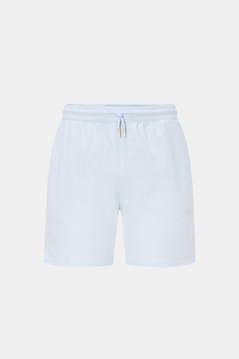 Front view of 04651/ A trip in a bag Swim shorts 'Mono Seersucker' pastel blue with elastic waistband and drawstring, seersucker texture.

Description: Perfect for your next summer holiday: With their design in seersucker look, these swim shorts by 04651/