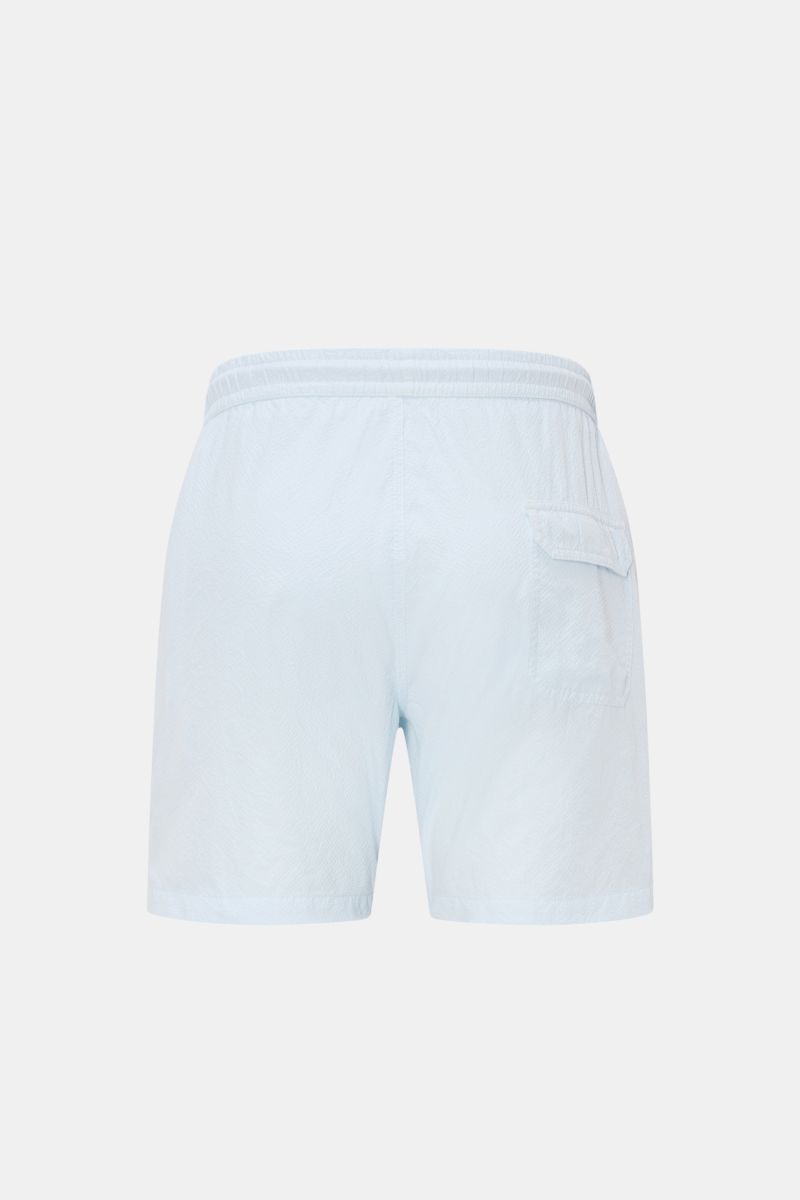 Rear view of 04651/ A trip in a bag Swim shorts 'Mono Seersucker' pastel blue with elastic waistband, back pocket with flap, and seersucker texture

Description: Perfect for your next summer holiday: With their design in seersucker look, these swim sho