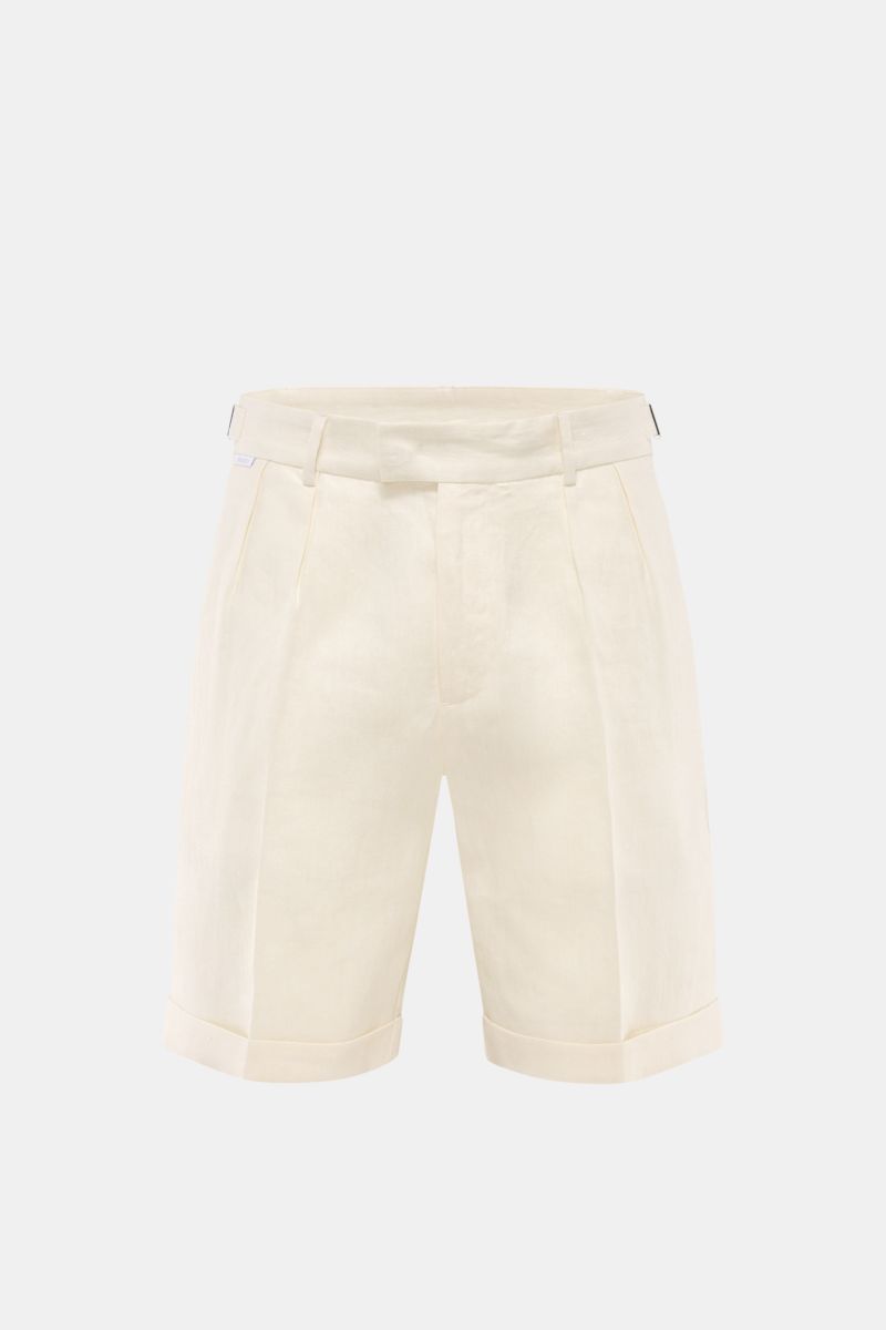 Front view of 04651/ A trip in a bag Linen shorts cream in pure linen with double pleats, side adjusters, French pockets, hip pockets, fixed hem turn-up.

Perfect for warm days: These linen shorts by 04651/ A TRIP IN A BAG are the ideal summer essentia