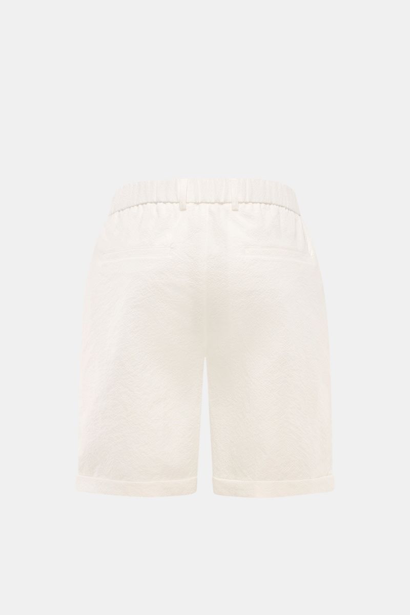 Rear view of 04651/ A trip in a bag Seersucker shorts white, made of textured microfibre with elasticated waistband, French and hip pockets, double pleat, and fixed hem turn-up.  

With this classic model, 04651/ A TRIP IN A BAG presents a comfortable 