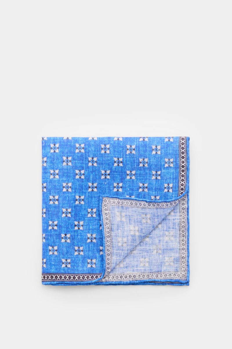 Rosi Collection Linen pocket square 'Fox' rust brown/blue/off-white patterned, pure linen, soft feel, floral print with edging, rolled edges, made in Italy, 31 cm x 31 cm, folded flat photographed from above.