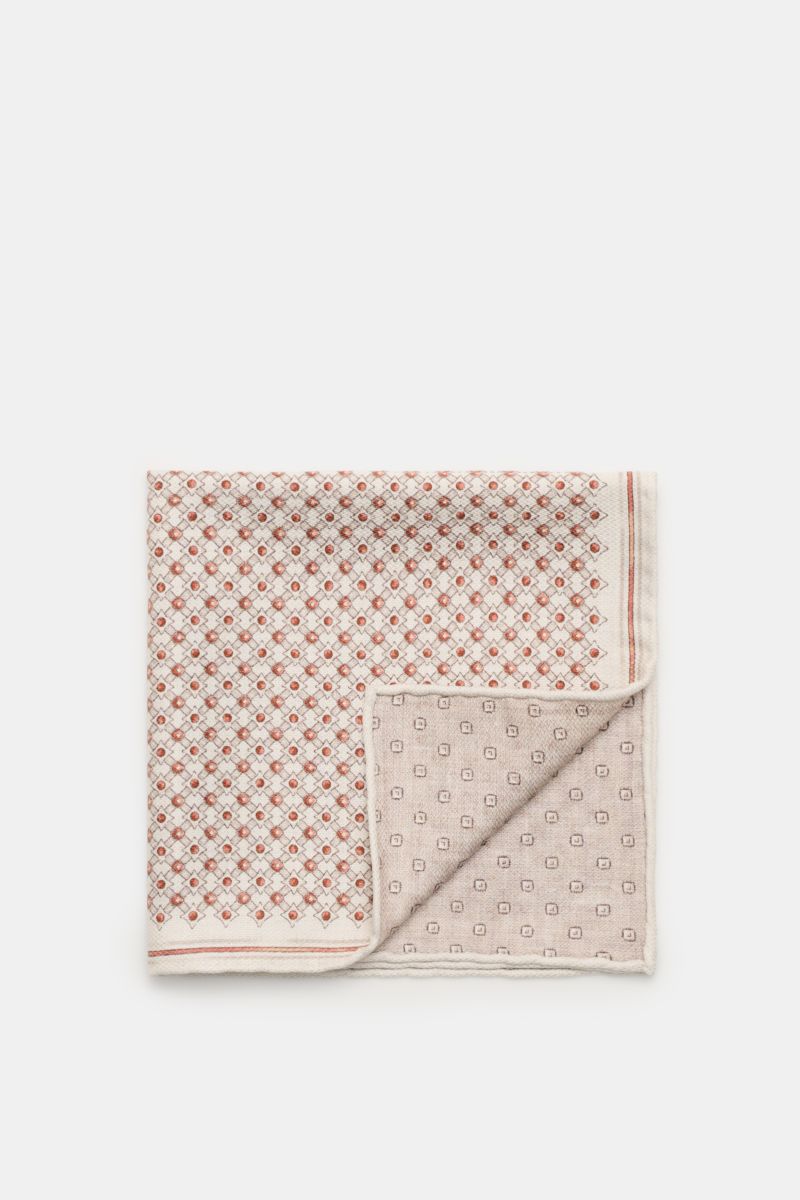 Top-down view of the Brunello Cucinelli Silk pocket square 'Fox' sand/rust brown/beige patterned, showcasing its graphic print with rolled edges and contrasting front and back designs.

Elegant and eye-catching: This pocket square in pure silk by BRUNE