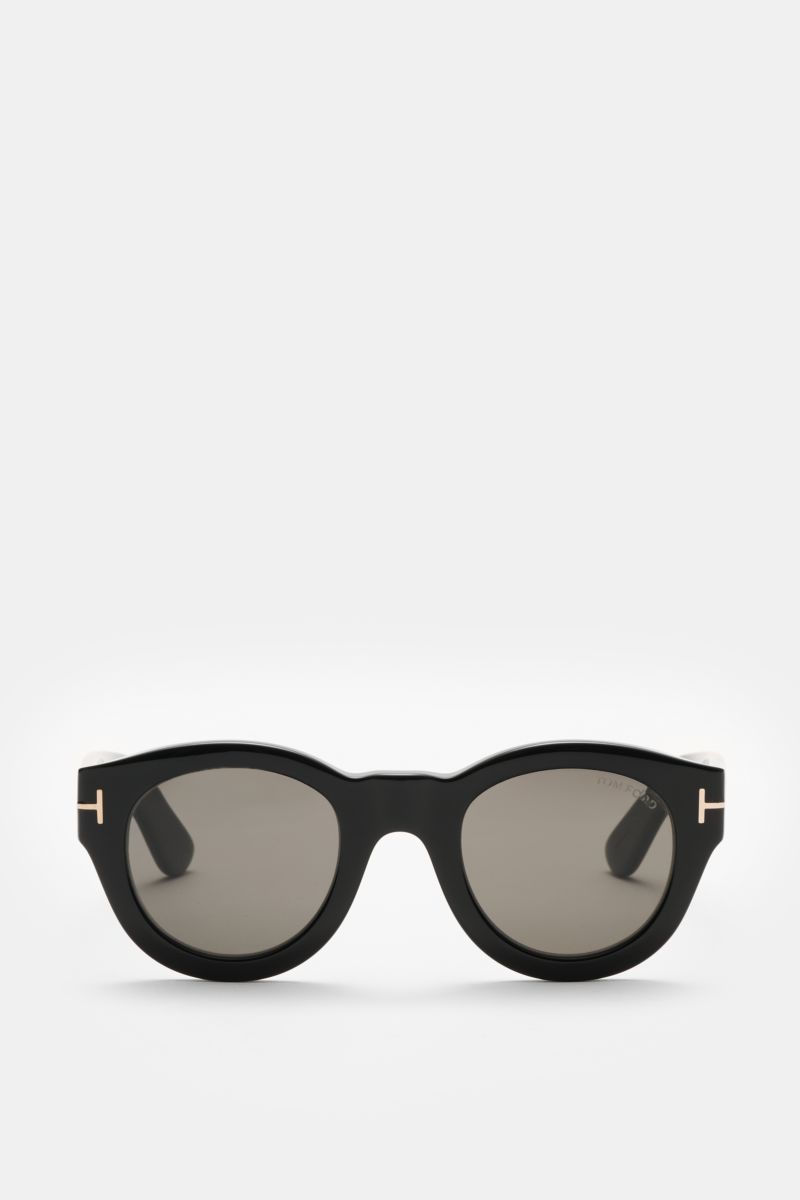 Tom Ford Sonnenbrille 'Lucinda' schwarz, frontal fotografiert, gerundete Silhouette, Acetat-Rahmen, getönte Kunststoffgläser, UV-Schutz, mit Samt-Etui.