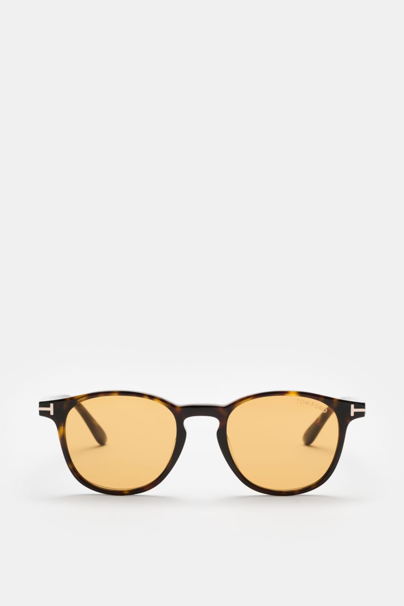 Tom Ford Sonnenbrille 'Holt' dunkelbraun meliert/gelb, frontale Nahaufnahme, leicht gerundete Silhouette, melierte Acetat-Fassung, gelbe Kunststoffgläser, UV-Schutz.