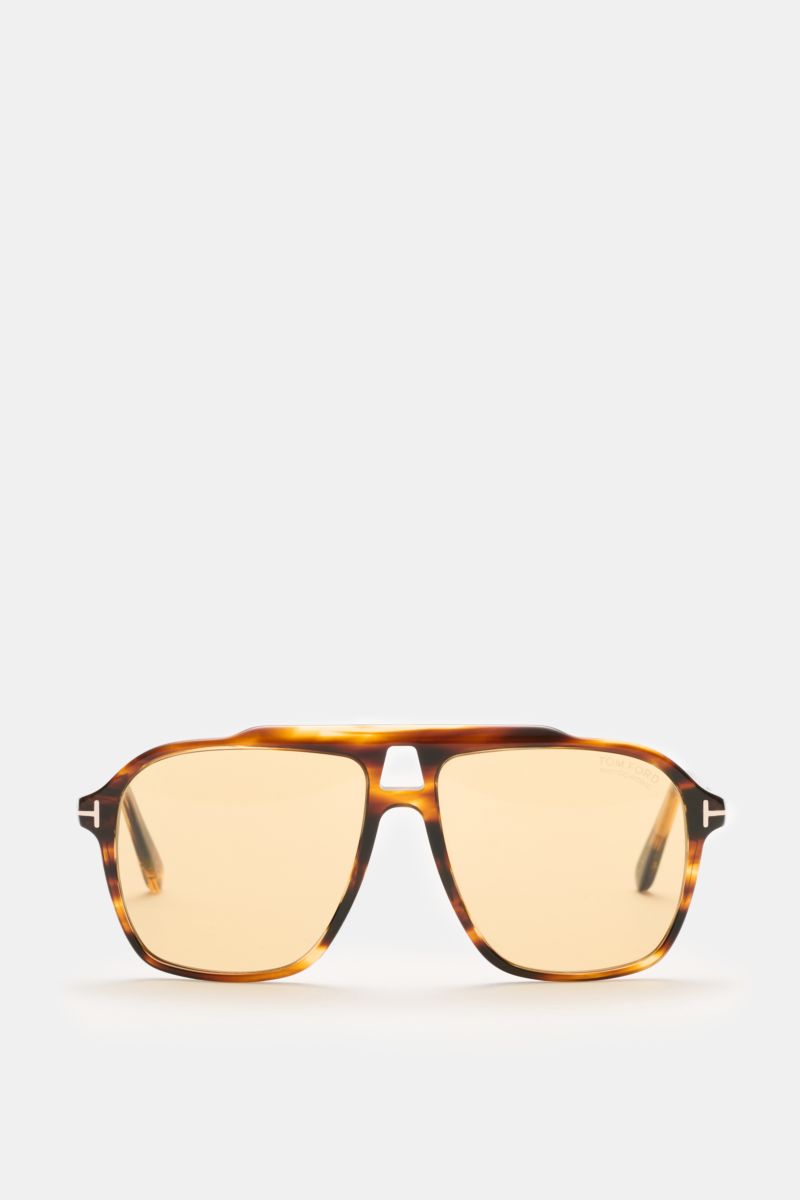 Tom Ford Sonnenbrille 'Autari' dunkelbraun meliert im klassischen Aviator-Stil mit photochromen Kunststoffgläsern frontal fotografiert.