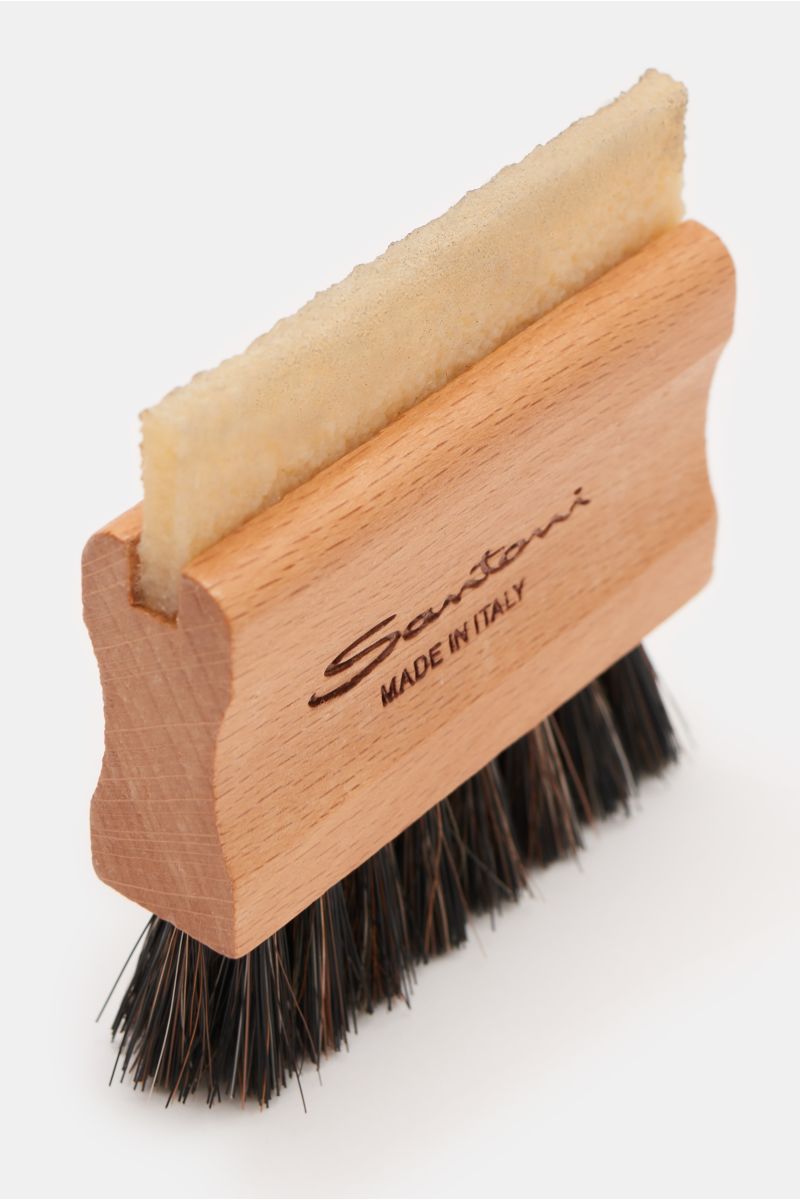 Santoni Polierbürste with wooden handle, horsehair bristles, and rubber detail, photographed from a high angled close-up view.