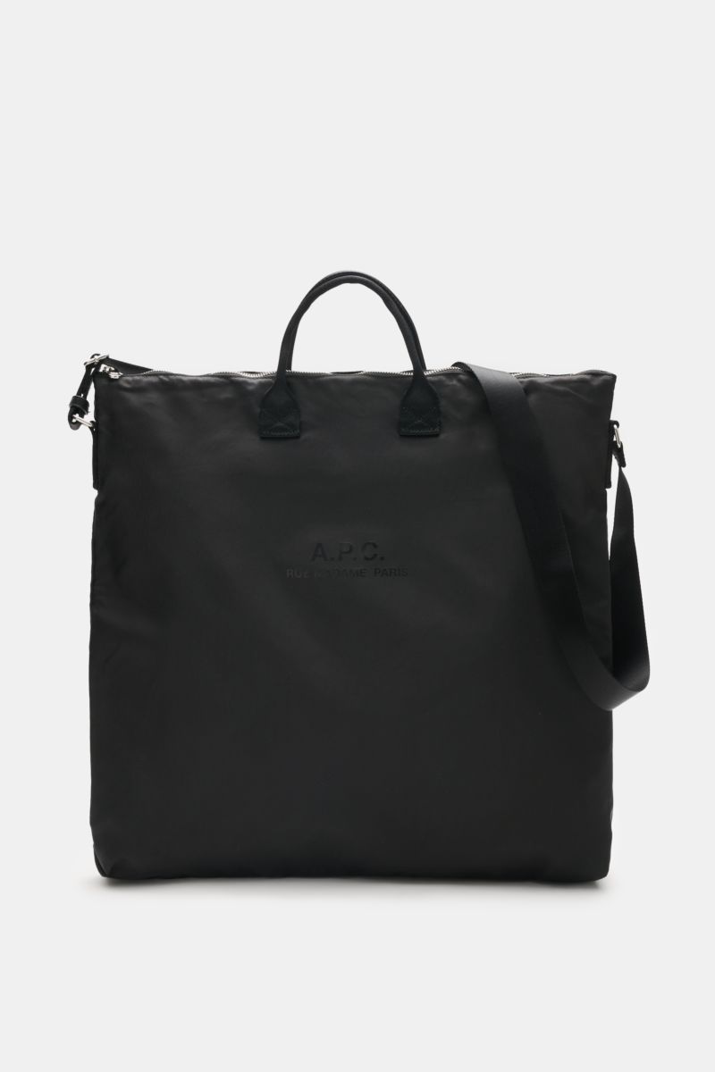 A front view of the A.P.C. Tasche 'Crossbody Bag Backstage' schwarz, a versatile everyday companion made of high-quality black microfiber with silver hardware, durable textile straps, a practical shoulder strap, logo print on the front, spacious main comp