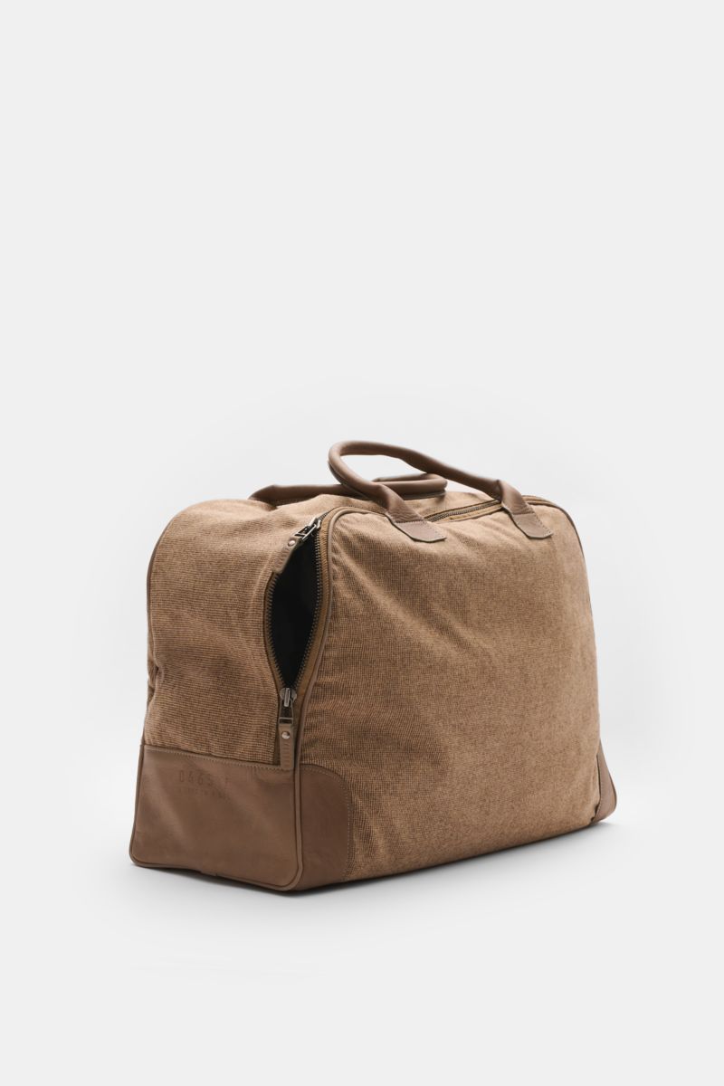 Side perspective of the 04651/ A trip in a bag Weekender '356-Bag Tweed' beige/taupe checked, fabric and leather travel bag with robust leather handles, two-way zip, embossed logo, protective metal feet, and spacious compartments. When holiday time comes,