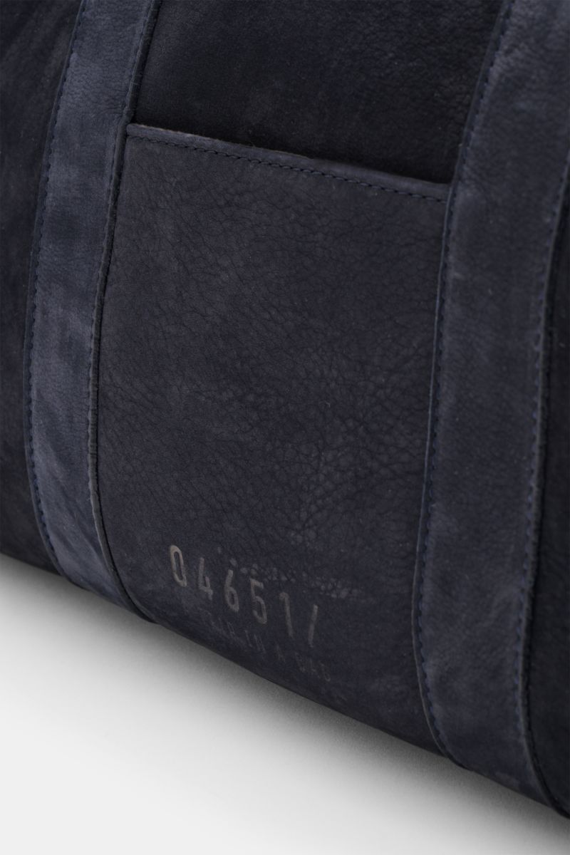 Close-up side view of the navy 04651/ A trip in a bag Weekender '3-Day Bag' showing soft velours leather texture and logo embossing, featuring smooth grip, adjustable size, anthracite hardware, two-way zipper, spacious main compartment, inner zipper pocke