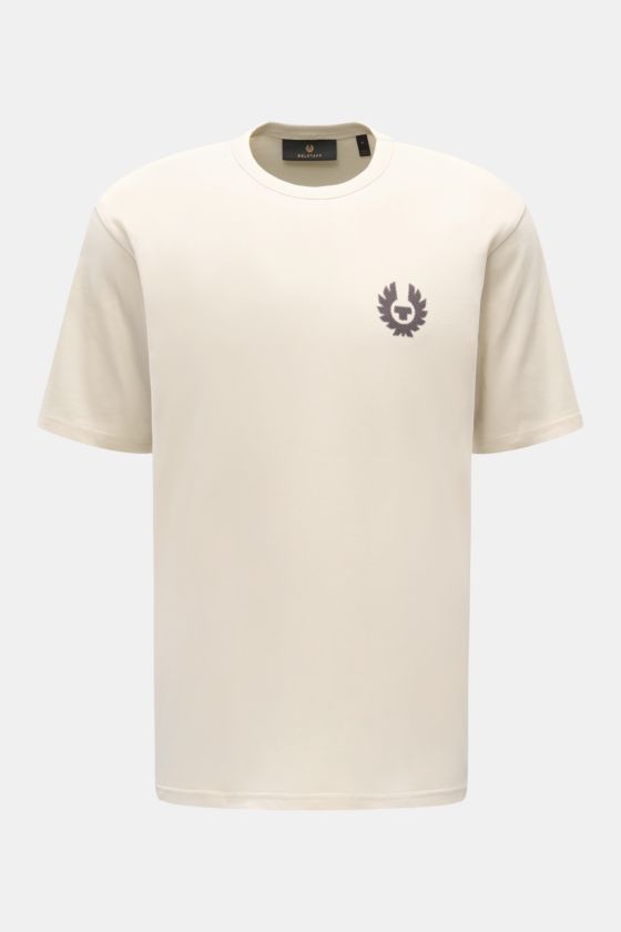 Belstaff Rundhals-T-Shirt 'Shadow' beige, frontal fotografiert, aus weichem Baumwolljersey mit Phönix-Logo auf der Brust, Regular Fit. Belstaff Rundhals-T-Shirt 'Shadow' beige, frontal fotografiert, aus weichem Baumwolljersey mit Phönix-Logo auf der Brust, Regular Fit.