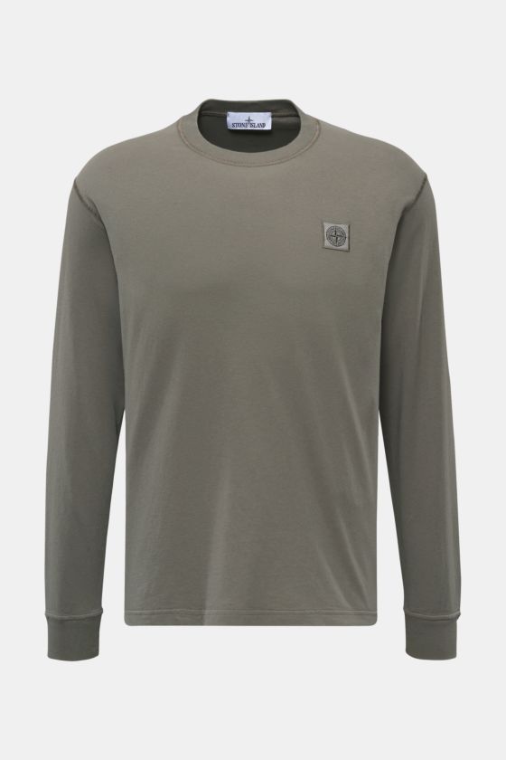 Stone Island Rundhals-Longsleeve grau, Slim Fit, aus weichem Baumwolljersey, frontal fotografiert mit Kompass-Logo und Rippbündchen. Stone Island Rundhals-Longsleeve grau, Slim Fit, aus weichem Baumwolljersey, frontal fotografiert mit Kompass-Logo und Rippbündchen.